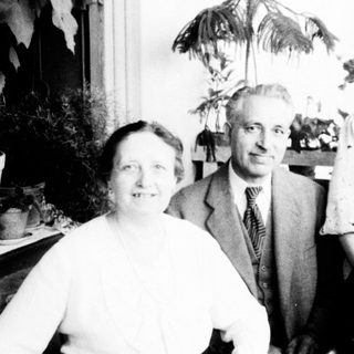 Family portrait from mid-20th century indoors.