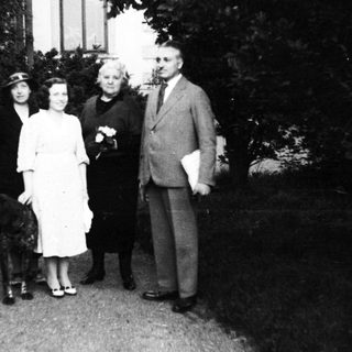 Family portrait with dog, mid-20th century.