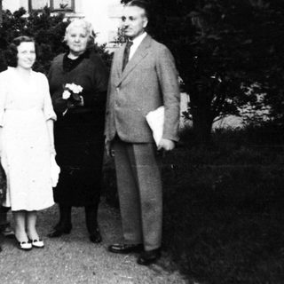 Family portrait with dog, mid-20th century.