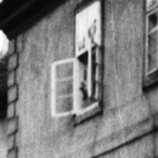 Narrow canal flanked by old buildings.