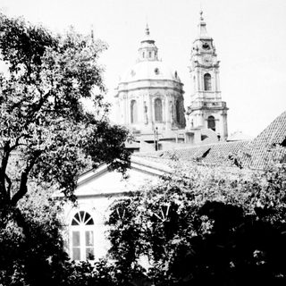 Historic church with twin domes and bell towers.