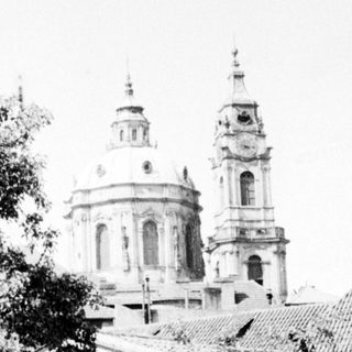 Historic church with twin domes and bell towers.