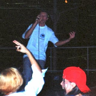 Here's a brief summary: Men on stage performing for a crowd.