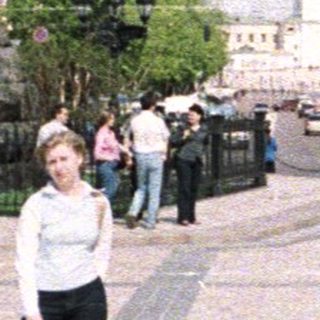 Monument and cityscape with a person standing in the foreground.