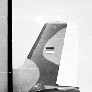 Here's a brief summary of the image: Military aircraft fly near an airplane with Egyptian markings.