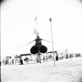 Black and white photo of an aircraft on display.