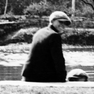 Children gathered near a body of water, possibly a canal.