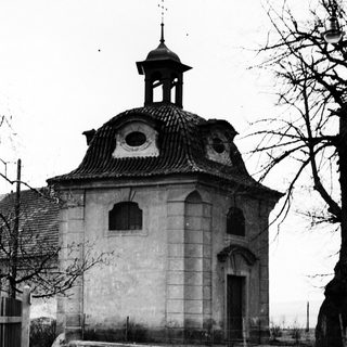 Black and white photo of a historic building with a dome.