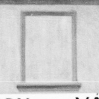 Black and white photo of a building with signage.