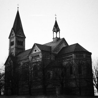 Black and white photograph of a stone church building.