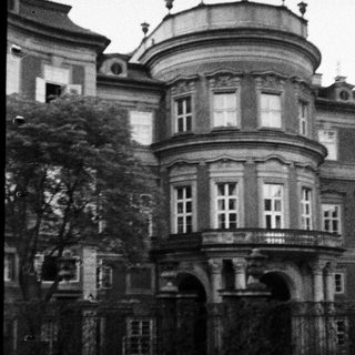 Black and white image of an old, ornate building.