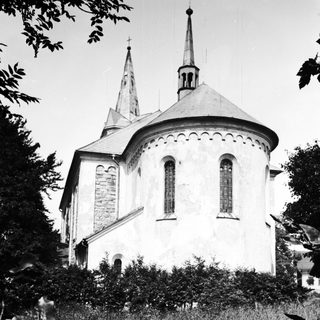 Black and white image of a unique, rounded church building.