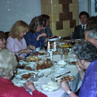Group seated at a table enjoying a formal dinner.