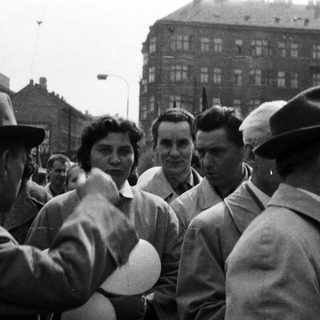 Black and white photo of people in a crowd.