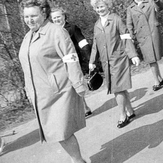 Here are a few brief summaries of what the images show: Image 1: Women in coats walking outside a building. Image