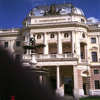 Here's a brief summary of the image: Exterior view of the Slovak National Theatre building.