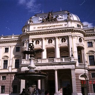 The image shows the Slovak National Theatre building.