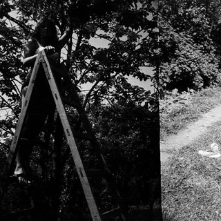 Here's a brief summary: Two scenes: a person on a ladder, someone relaxing in a chair.