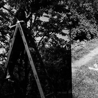 Here's a brief summary: Two scenes: a person on a ladder, someone relaxing in a chair.