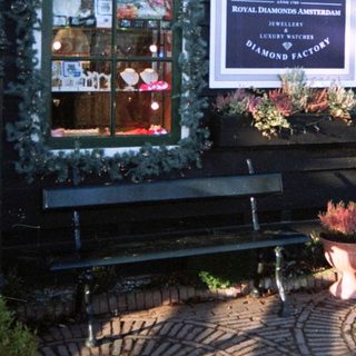 Dutch storefront displays jewelry and Delft pottery.
