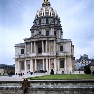 Person standing near the Arc de Triomphe in Paris.