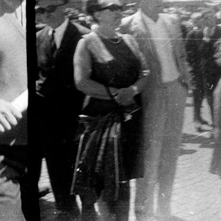 People gathered outdoors, possibly at an event or gathering.