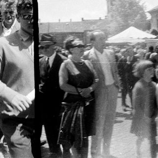 People gathered outdoors, possibly at an event or gathering.