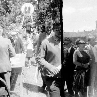 People gathered outdoors, possibly at an event or gathering.