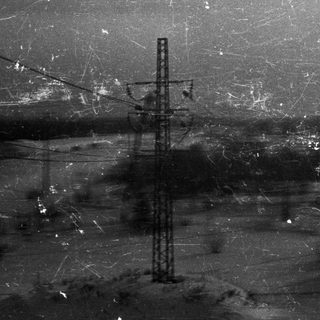 Power lines and landscape visible through film grain.