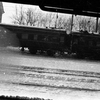 Vintage black and white image of a passing train.