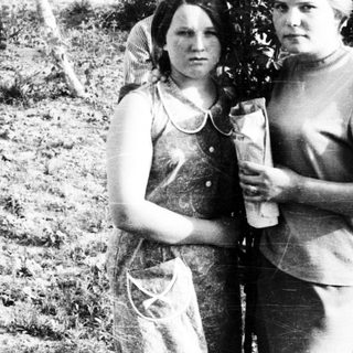 Black and white photo of two women and a young boy.