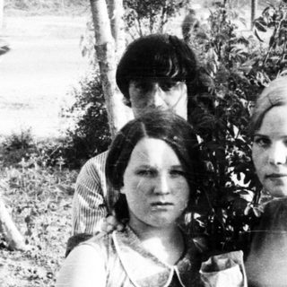 Black and white photo of two women and a young boy.