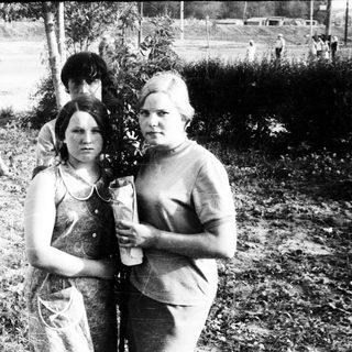 Black and white photo of two women and a young boy.