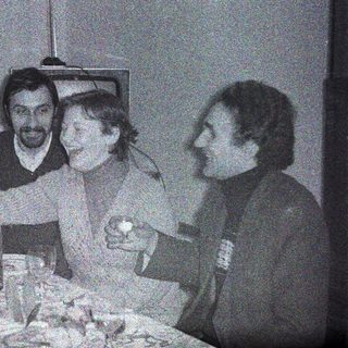 Group of men appear to be dining and socializing.