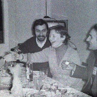 Group of men appear to be dining and socializing.