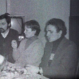 Black and white photo of people at a table.
