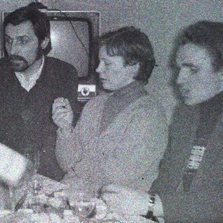 Black and white photo of people at a table.