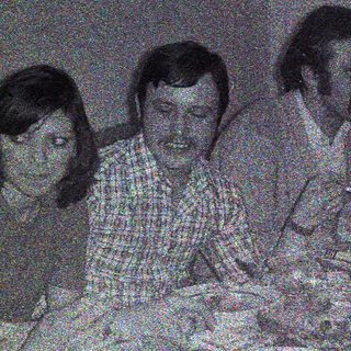 Group seated at a table, appearing to be dining.