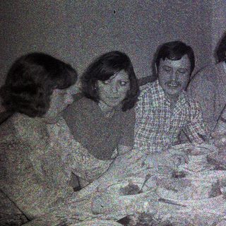Group seated at a table, appearing to be dining.
