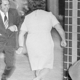 People dancing indoors, possibly at a party or event.