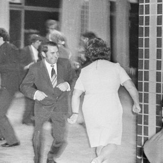 People dancing indoors, possibly at a party or event.