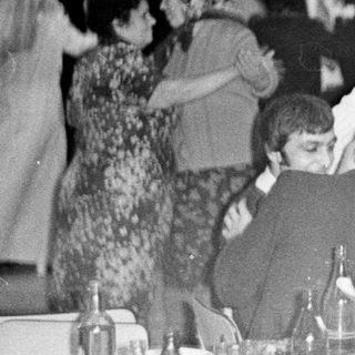 Group at a formal dinner, possibly a celebration.