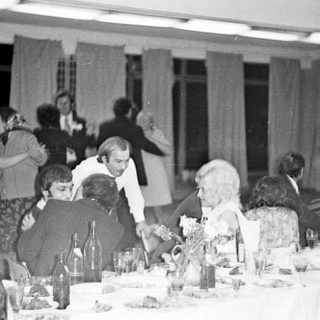 Group at a formal dinner, possibly a celebration.