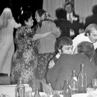 Group at a formal dinner, possibly a celebration.