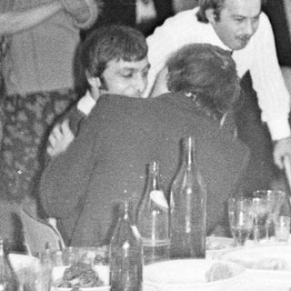Group at a formal dinner, possibly a celebration.