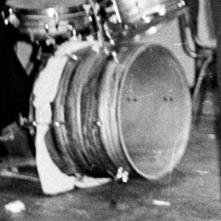 Band performing on stage, likely in the 1970s.