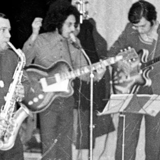 Band performing on stage, likely in the 1970s.