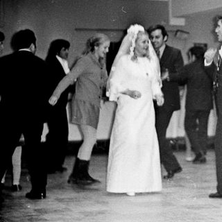 Black and white photo of a wedding reception dance.
