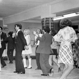 Black and white photo of a wedding reception dance.
