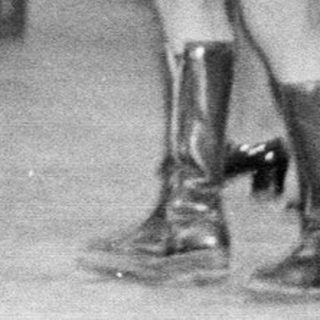 Couple dances at a wedding reception in the 1970s.